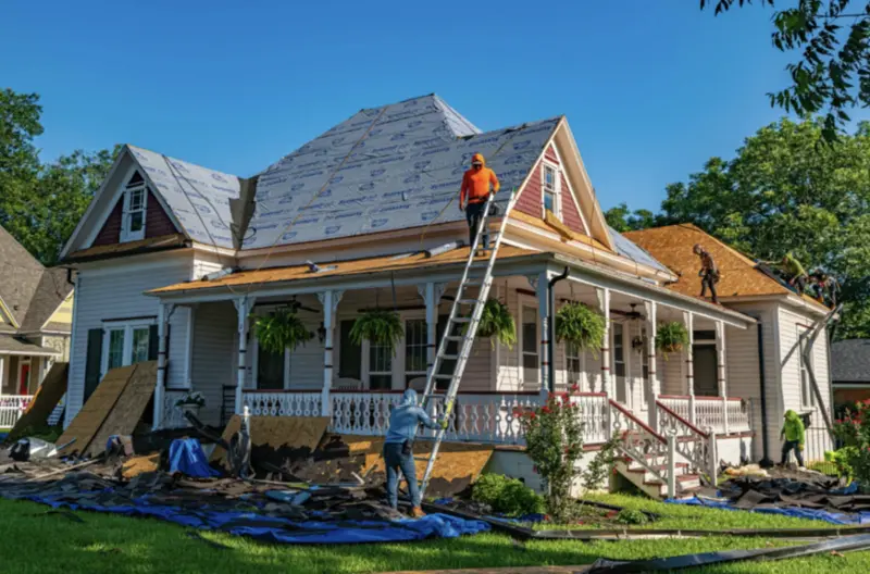 Victorian home receiving a new roof and porch during an addition