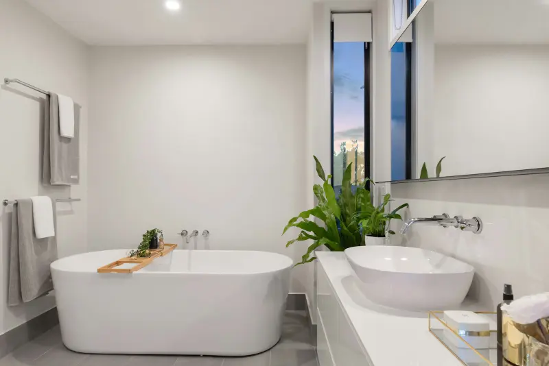 Bathroom with a freestanding tub and vessel sink