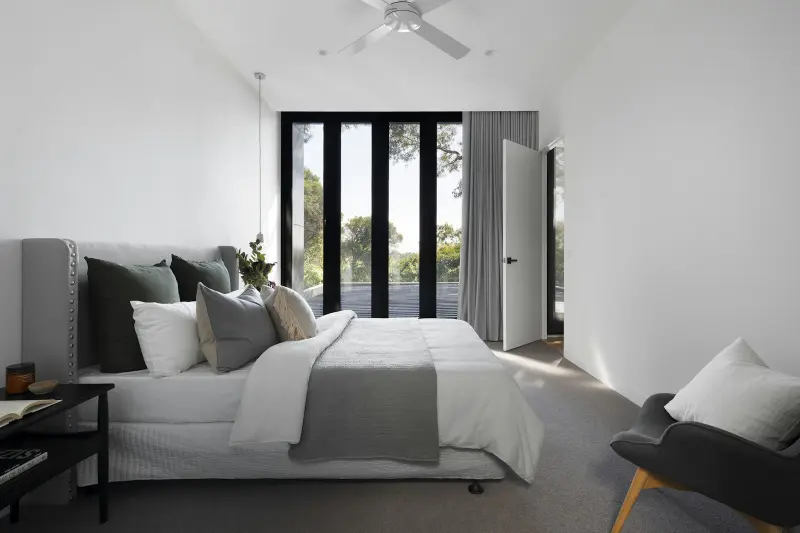 Modern bedroom with floor-to-ceiling windows